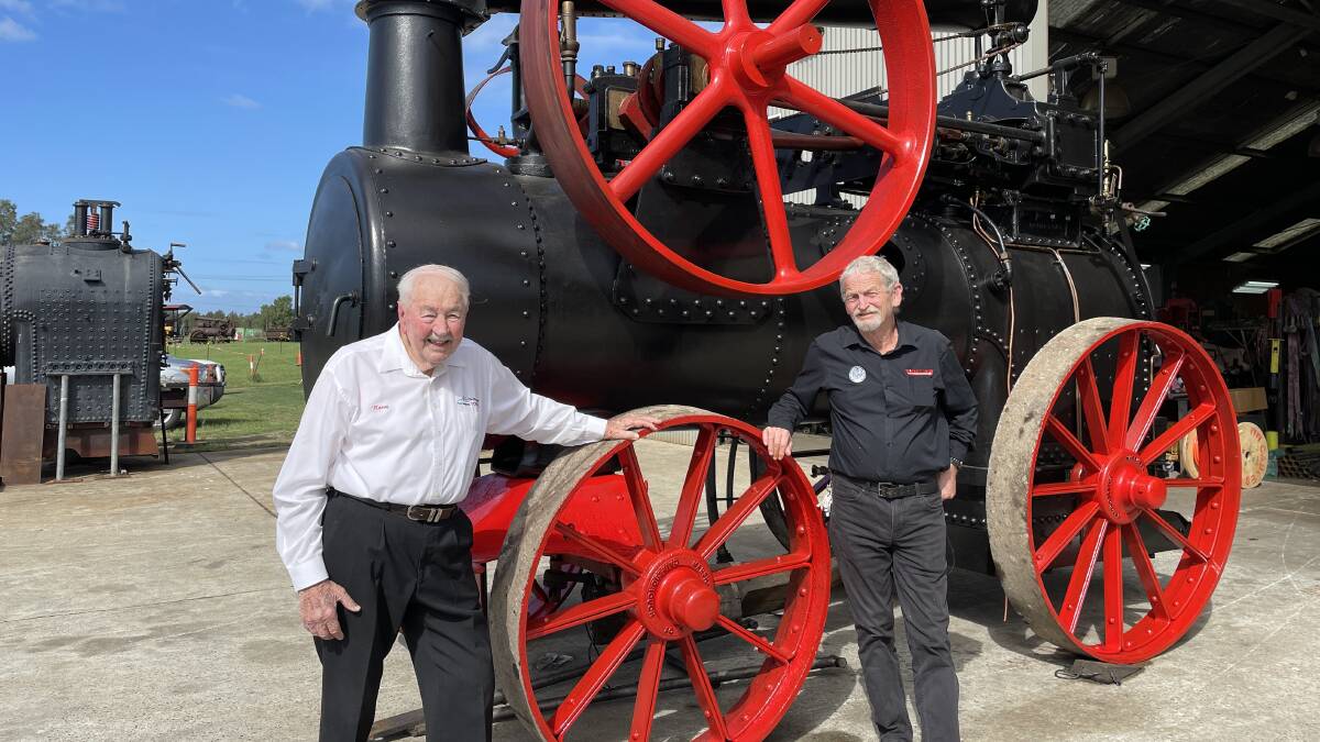 Hunter Valley Steamfest Committee chairman Peter Garnham and Burton Automotive owner Norm Burton with a Marshall 1912 14 horsepower portable steam engine. Picture by Chloe Coleman