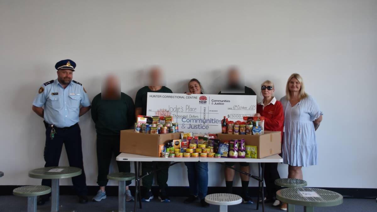 Hunter Correctional Centre inmates donated $3000 and a generous pile of non-perishable food items to Jodie's Place. Picture by Laura Rumbel