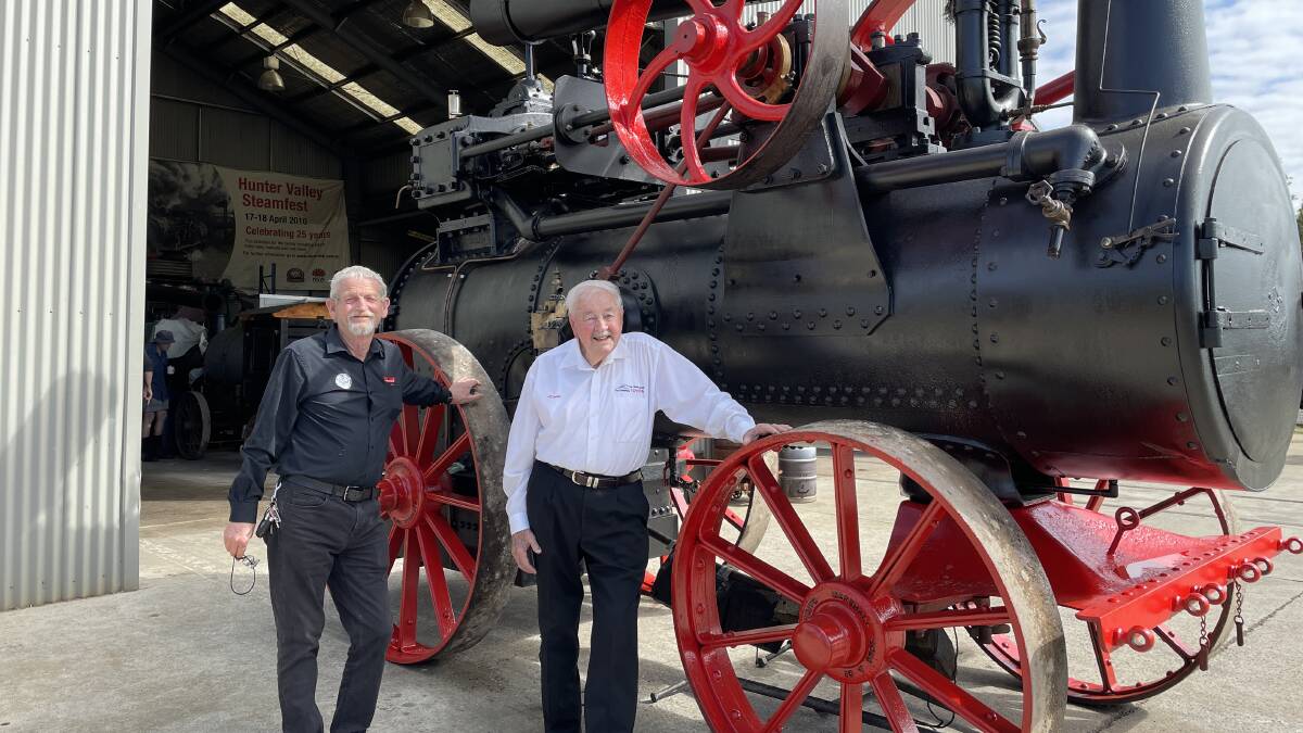 Hunter Valley Steamfest Committee chairman Peter Garnham and Burton Automotive owner Norm Burton with a Marshall 1912 14 horsepower portable steam engine. Picture by Chloe Coleman