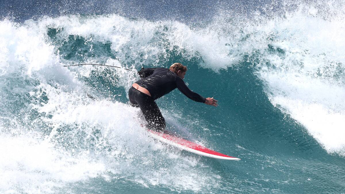 International surfer: Jade 'Reddog' Wheatley has surfed in international competitions before hosting his own adpative surf competition in 2019. He said Newcastle is still one of his favourite spots. Picture: Jonathan Carroll