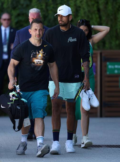 Nick Kyrgios walking to a practice session with his physiotherapist Will Maher. Picture: Getty Images