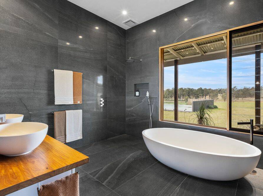 The luxury bathroom features a stone bathtub. Picture supplied
