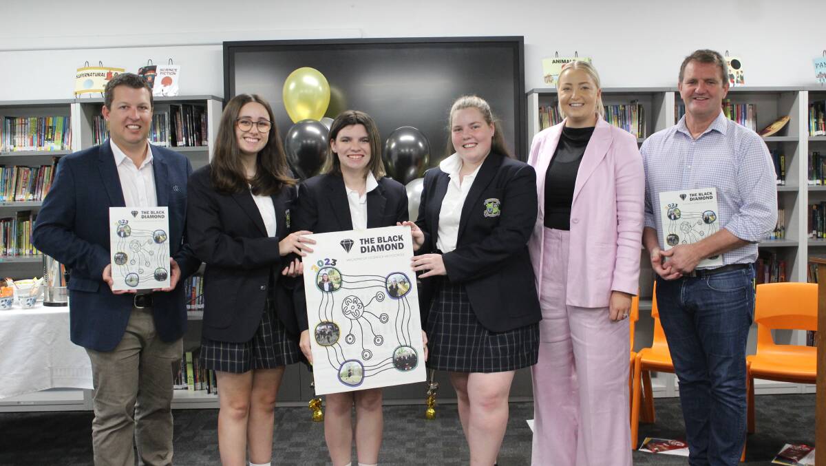 Cessnock Mayor Jay Suvaal and State Member for Cessnock Clayton Barr MP with Cessnock High School's Black Diamond magazine team. Picture supplied
