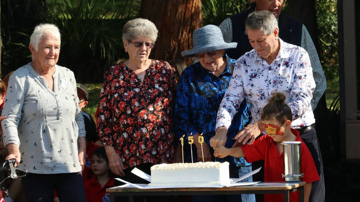 150 YEARS: Laguna Public School's youngest student and the school's oldest ex-student cut the celebratory cake on May 6. Picture supplied