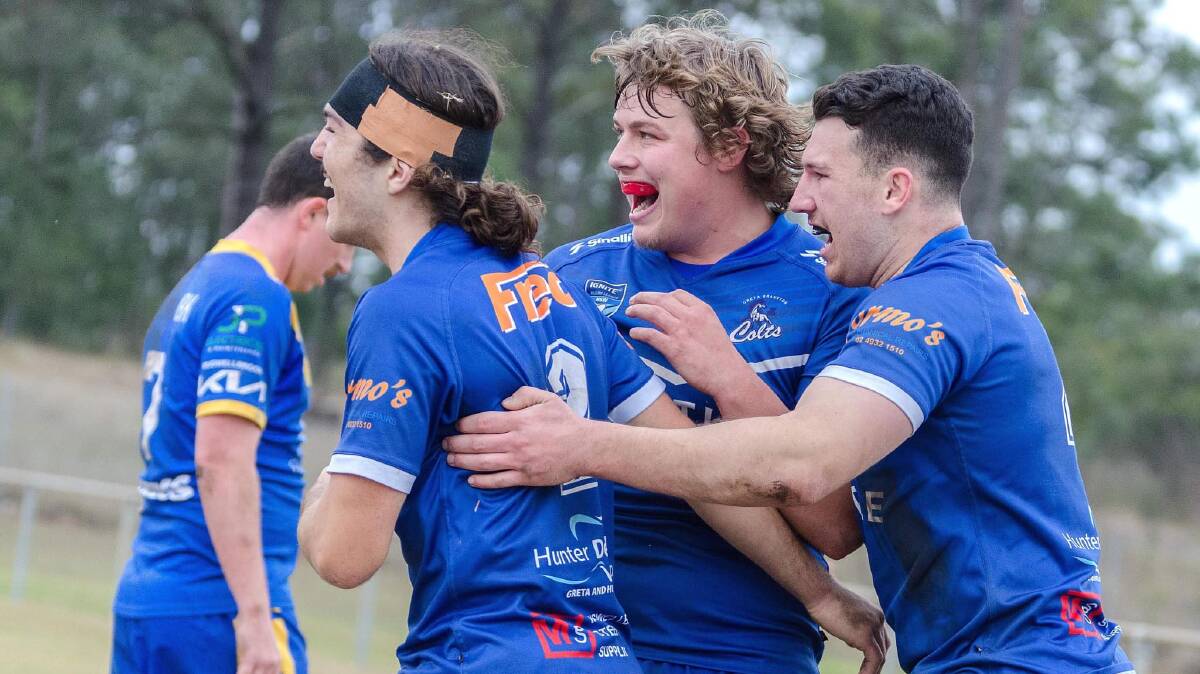 Greta Branxton five-eighth Patrick Andrews (centre) celebrates after the Colts score a try against Muswellbrook at Greta Central Oval on Sunday, June 4. Picture by Daniel Johnson Imaging
