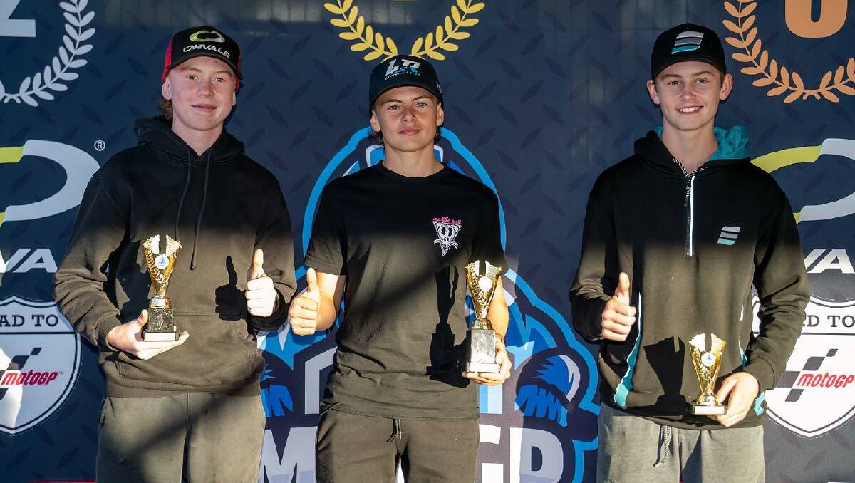 Cameron Dunker, centre, with Levi Russo, left and Harrison Watts. Cameron took first place at the FIM MiniGP at Cameron Park on Sunday, May 21. Picture by RbMotoLens