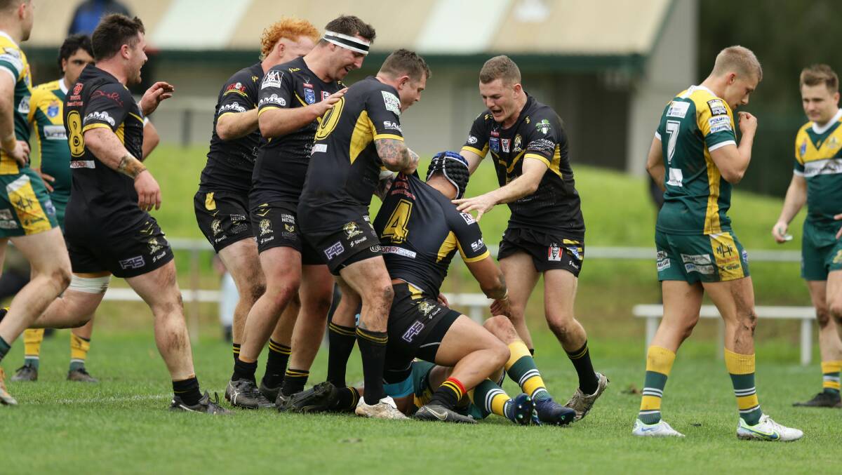 The Goannas celebrate a Honeti Tuha try against Macquarie Scorpions in 2022. Tuha grabbed a double as Cessnock beat Lakes United on Saturday, May 20. Picture by Jonathan Carroll. 