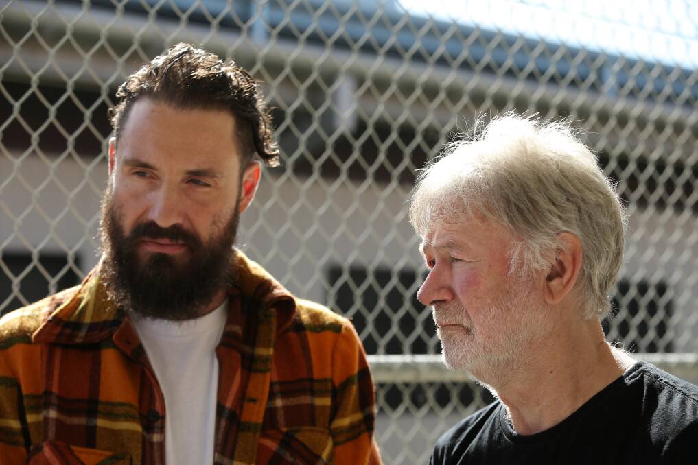 William Crighton and John Schumann outside the music room at Cessnock Correctional Centre during rehearsals with inmates on Wednesday. Picture by Simone De Peak