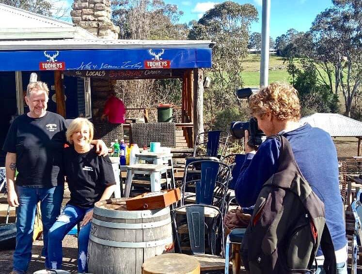 What a run: "It's coming on five years since I bought the place, so it has all been pretty crazy really," says Wollombi Tavern owner Chris Books, pictured with his wife.