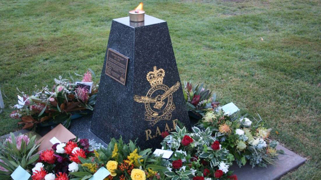 The Kearsley Cenotaph adorned with floral wreaths and tributes laid during the Dawn Service on Anzac Day 2018. Picture: Jordan Fallon


