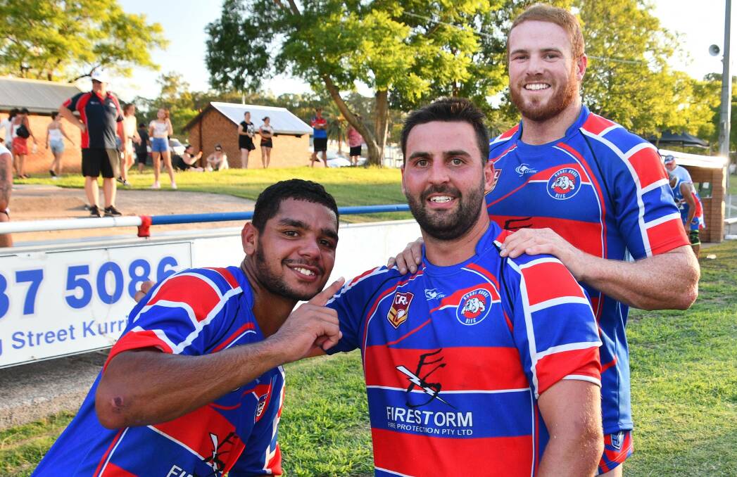 GOOD TIMES: Mark Walker, Ben Wyborn and Mitch Cullen celebrate after the Bulldogs claimed the inaugural Kurri Nines title. 