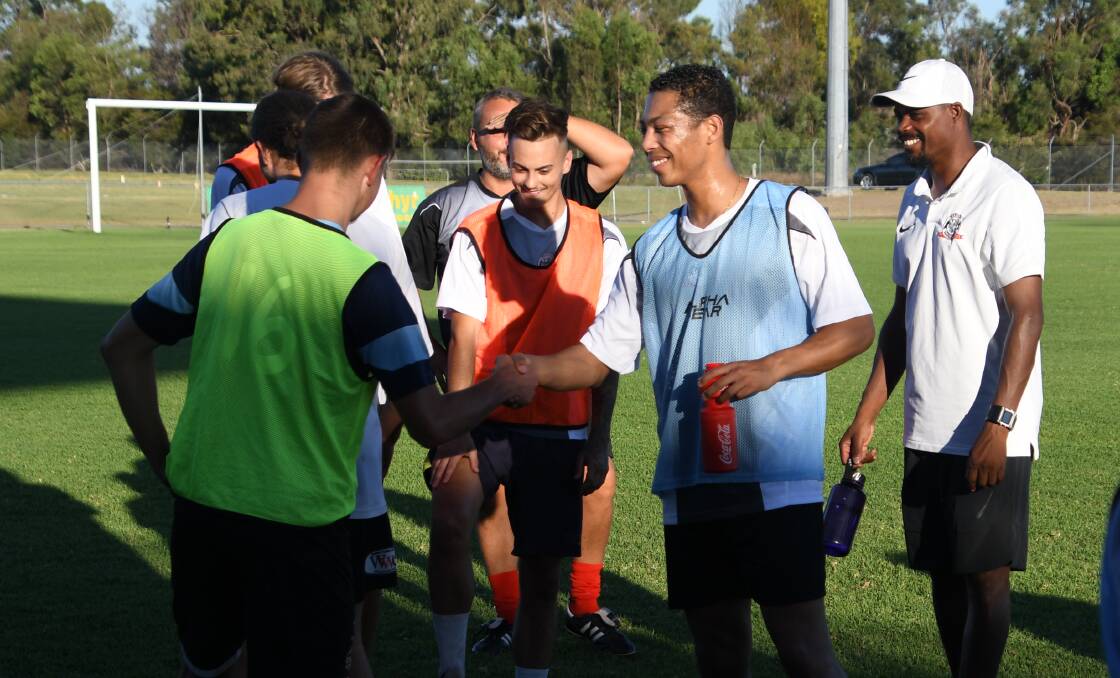 WELCOME ABOARD: Dutch import Jason Thien-Fooh (blue singlet) is introduced to his new Bears teammates. Picture: Michael Hartshorn