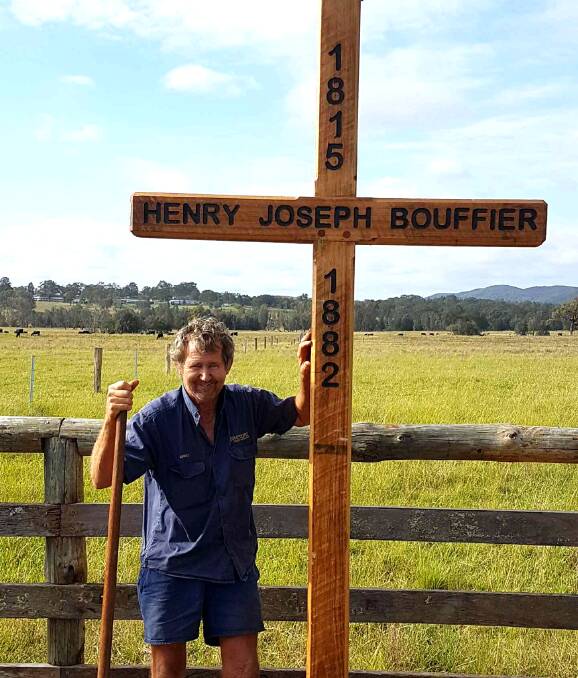 LOCAL HISTORY: Greg Drayton with the replica of the Bouffier Cross, which stands in a paddock on Debeyers Road, Pokolbin, where Henry Joseph Bouffier died in 1882.