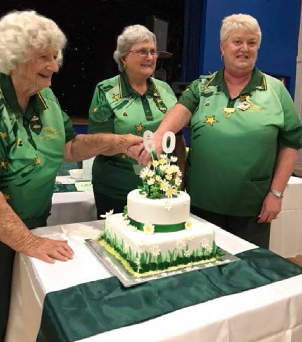 MILESTONE: Edna Jessop (oldest member), Julie McKim (president) and Tanya Jory (youngest member) cut the cake at East Cessnock Women's Bowling Club's 60th birthday celebrations.
