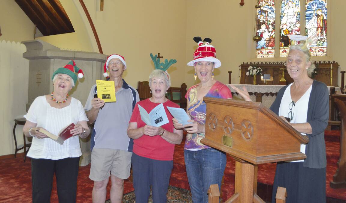 CELEBRATION: Barbara McPhee, Brian Drummond, Averil Drummond, Sue Griffith and Ruth Mackay, preparing for the Carols night at Christ Church Mount Vincent.
