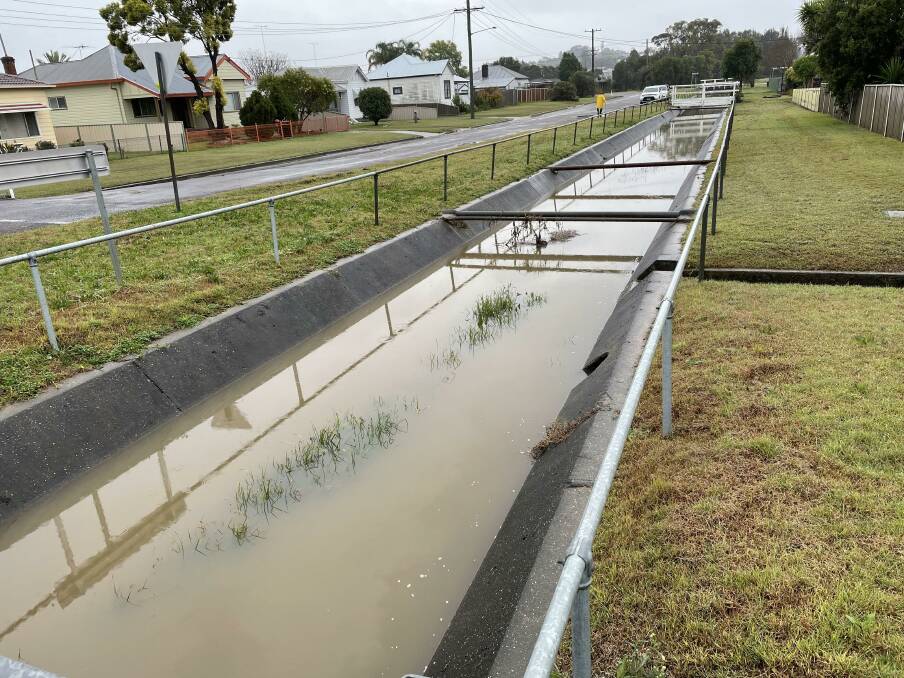 SUBSIDING: The creek in Oliver Street, Cessnock around 9am Wednesday.