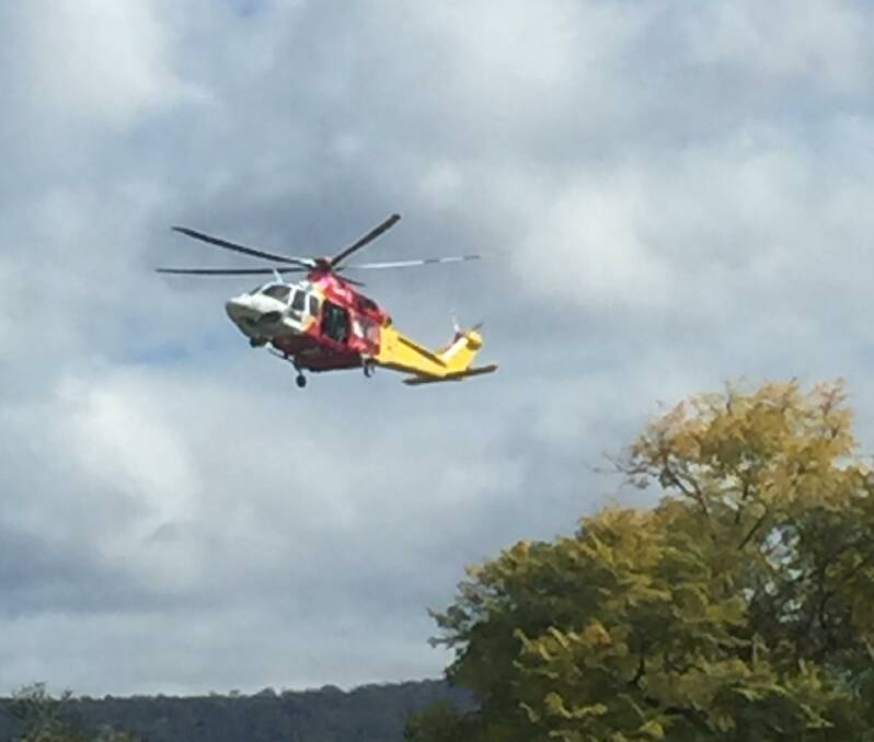 CALLOUT: The Westpac Rescue Helicopter lands at the scene in Bellbird on Tuesday.