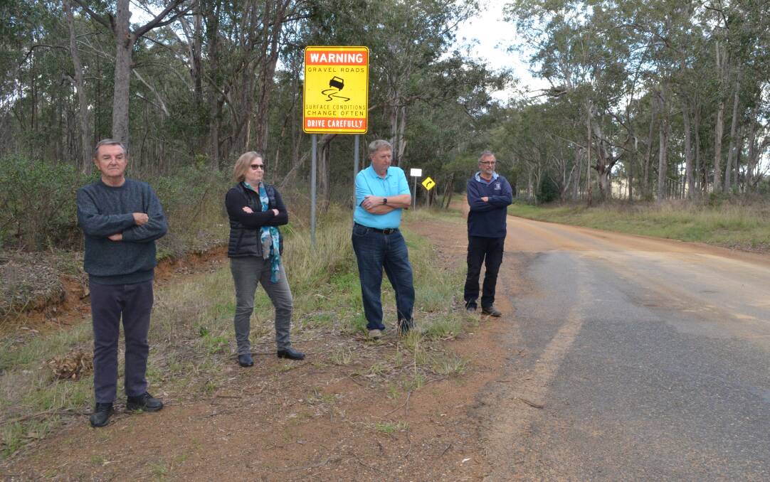 UPGRADE PLEA: Local residents and business owners Bruce Robinson, Vicci Lashmore-Smith, Mark Neely and Ross McDonald on Old North Road, Rothbury.