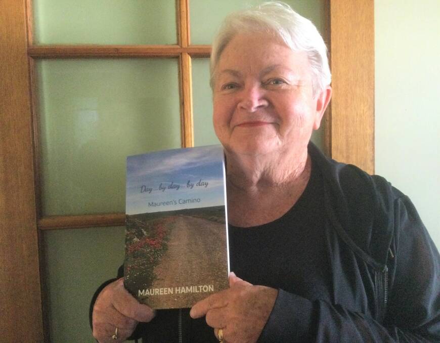 Cessnock resident Maureen Hamilton with her book about her Camino Frances pilgrimage in 2017. Picture by Garry Hamilton.