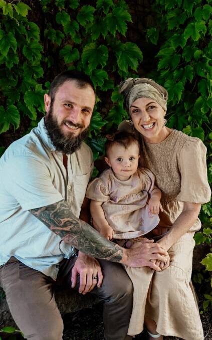 'BEAUTIFUL DISTRACTION': Eleisha and Clint with their daughter Wren, 15 months. Pictures: Anna Critchley Stylist