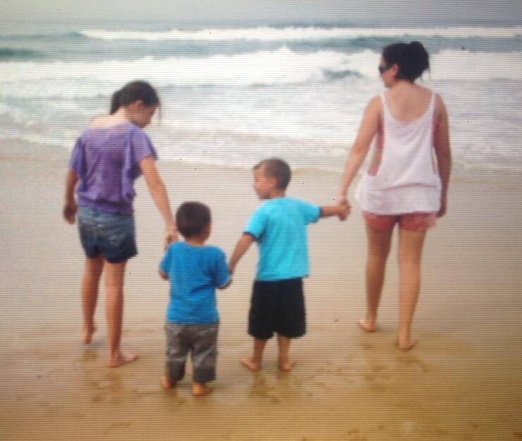 LOVED: Max* and his foster family on a trip to the beach. More than 350 carer households are currently needed in NSW.