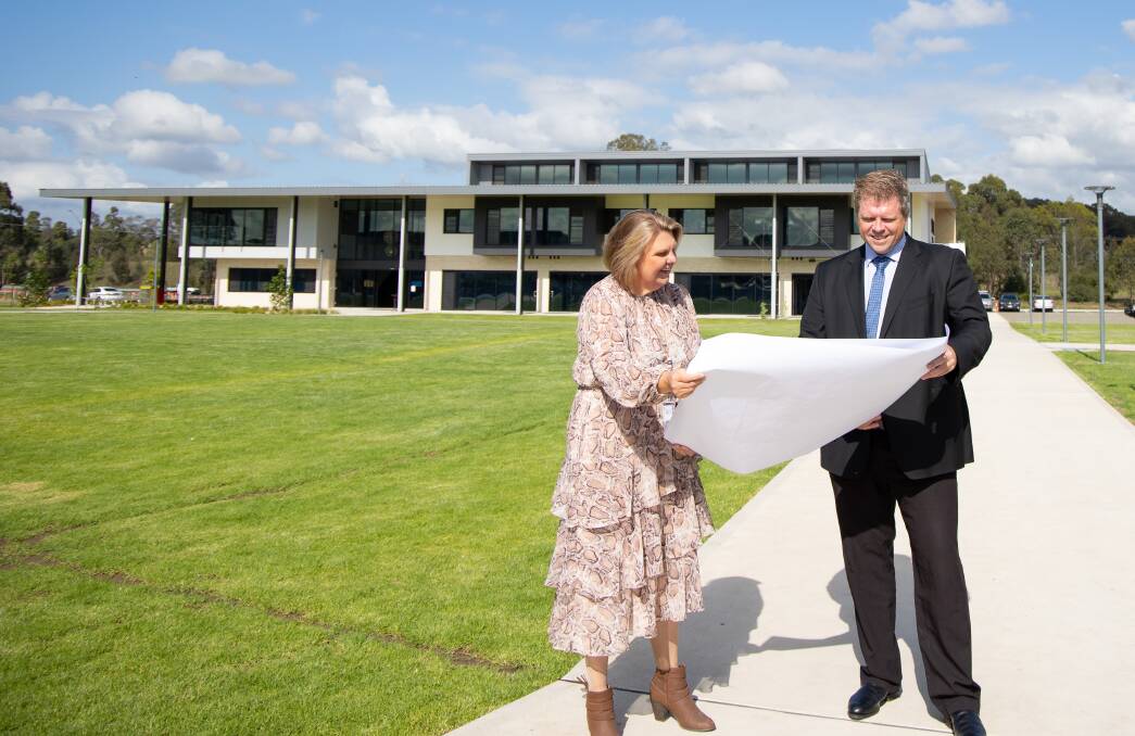 ROOM TO GROW: St Philip's Cessnock deputy principal Margaret Pond and principal Matt Connett look over the expansion plans. Picture: Chris Windus