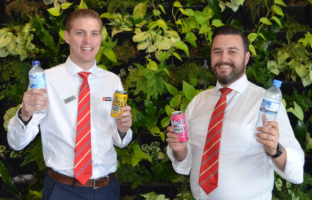 INITIATIVE: Brendon Smith and Bryce Gibson of LJ Hooker Cessnock, where they are collecting cans and bottles for the return and earn scheme, and in turn will raise funds for Cessnock and Kurri Kurri hospitals. Picture: Krystal Sellars