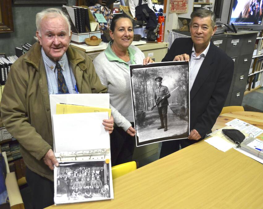 PROJECT: Coalfields Heritage Group secretary-treasurer Brian Andrews, Towns With Heart community projects manager Lesley Morris and assistant secretary Bill Holland with some of the Galloway Collection photos. Picture: Krystal Sellars