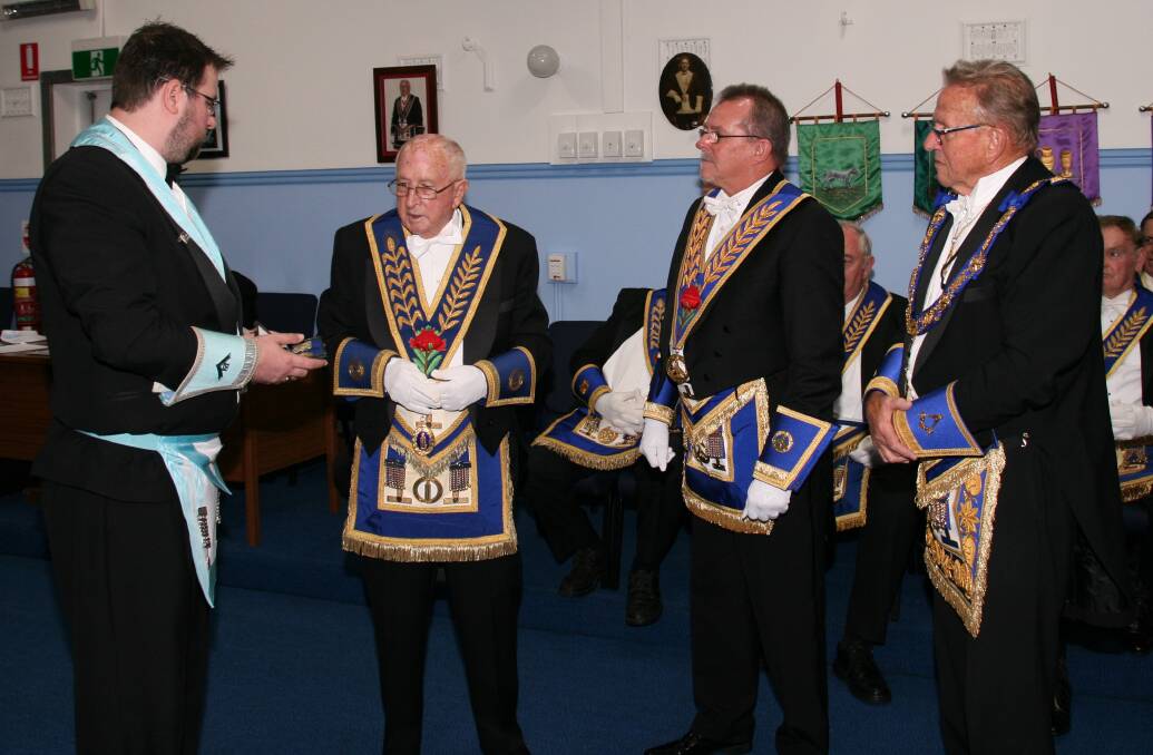 TRADITIONAL: Outgoing Master, W Brother Mitchell Perrin, his grandfather RW Brother Ron Hughes, VW Brother Mark Pollard and RW Brother Bill Driver at the ceremony at Lodge Tomalpin on April 14.