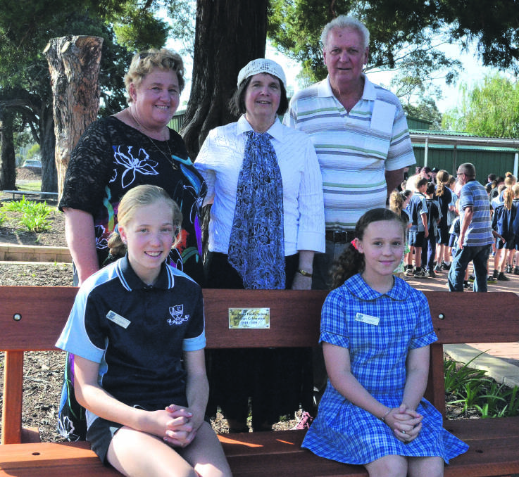 CENTENARY: Kitchener Public School staff Sue Firth and Sue Richard, and former student Lindsay Teasdale, and seated, captains Evie O'Neil and Breanna Newton on the bench that was unveiled as part of the school's centenary celebration on September 13. Picture: Krystal Sellars
