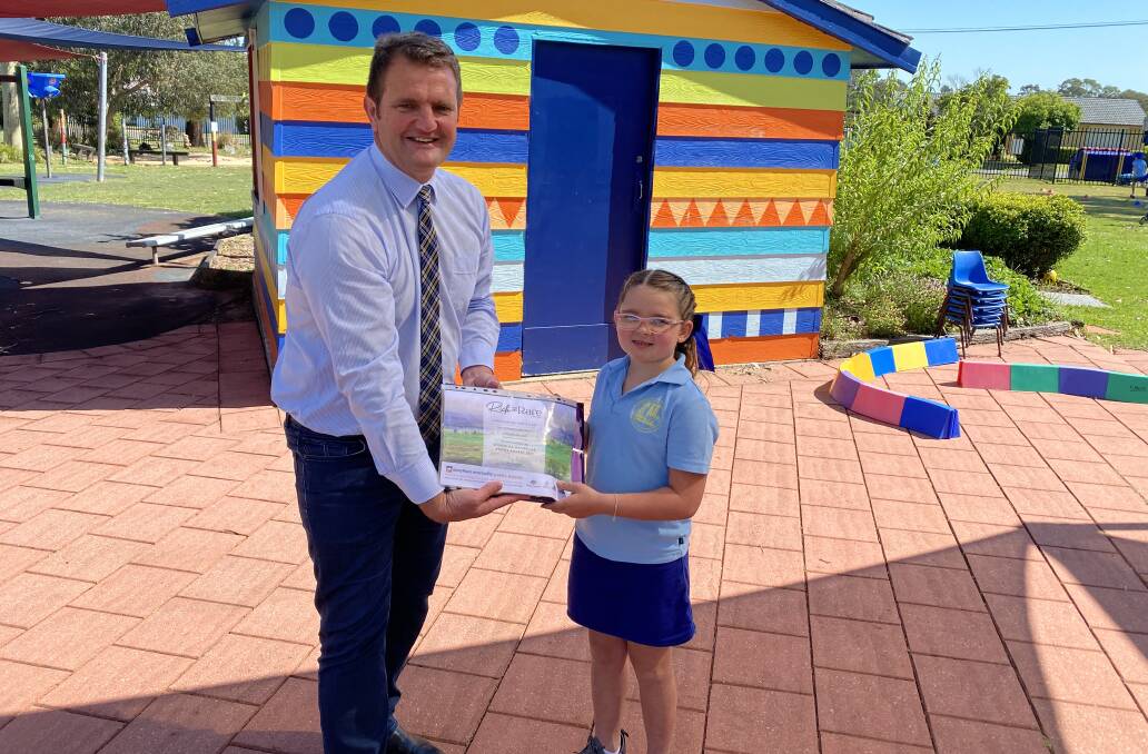 PRIZE: Cessnock MP Clayton Barr presents Aleigha Mudd with her runner-up prize from the Dorothea Mackellar Poetry Award.