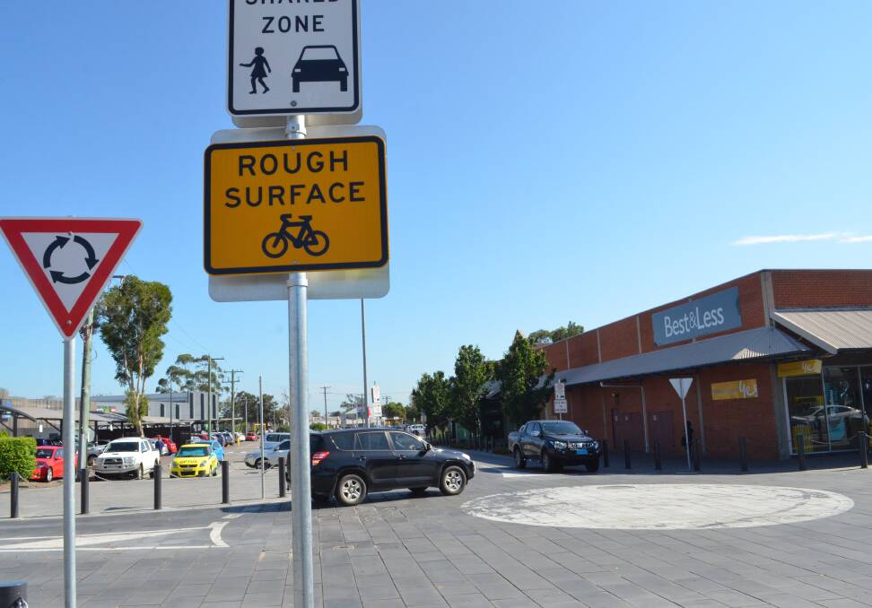 ROUGH SURFACE: Cessnock City Council has installed hazard signs to alert road users to the cracked pavers at the corner of Cooper and Charlton streets.