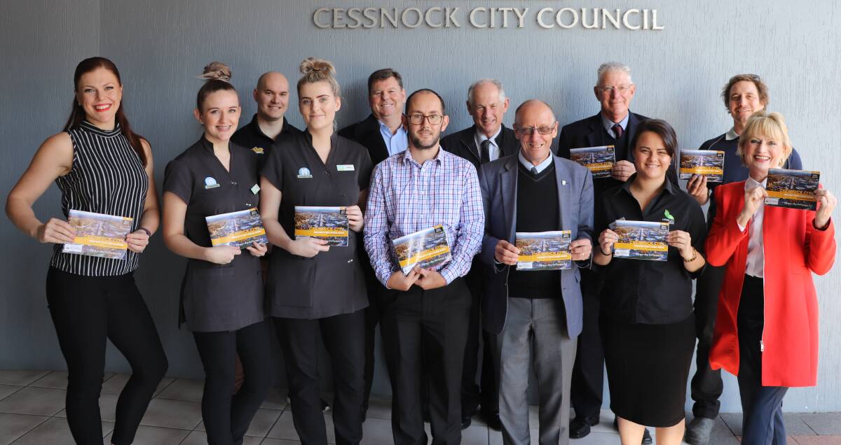 SHOP LOCAL: Rhiannon Stevens (Cessnock City Council), Kayla Perkins and Zoe McDougall (The Happy Tooth), Robert Brewster (East Coast Supplements), James Harvey (Sternbeck’s Real Estate), James Jarvis (AMP Vintage Wealth), Geoff Walker (Hunter Valley Visitor Information Centre), Eric Stanley (Financial Feedback), Cessnock mayor Bob Pynsent, Rose Beverley (Leisure Inn), Dayne Poole (Hunter Area Plumbing) and Jane Holdsworth (Cessnock City Council) with the Resident’s Buy Local Guide that was launched on Monday. Picture: supplied