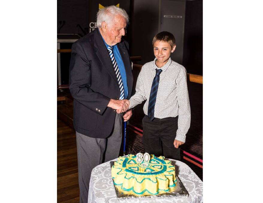 COMMUNITY: Cessnock Rotary Club's longest-serving member Brian Howe, and the club's youngest Interactor Jack White cut the 80th birthday cake. Picture: George Koncz