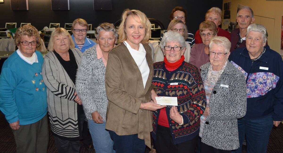 GENEROUS: Calvary Mater Newcastle scientist Dr Jennette Sakoff is presented with Coalfields Cancer Support Group's half-yearly donation of $12,000. Picture: Monique Smith