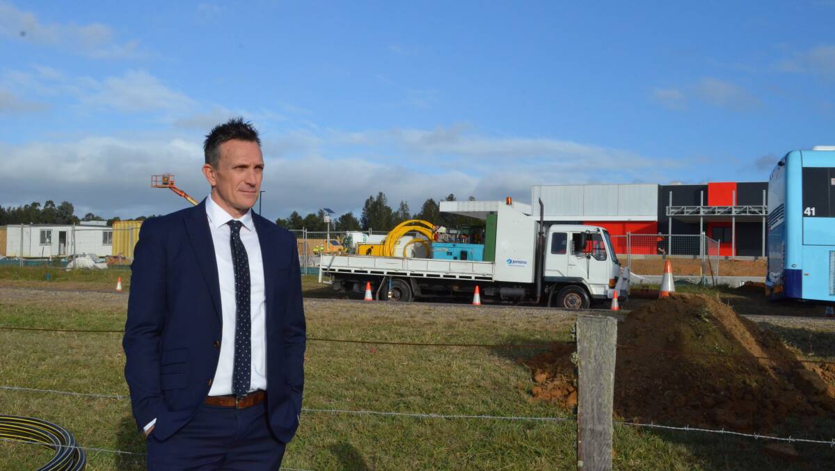 ACCESS POINT: St Philip's Christian College Cessnock principal Darren Cox at the site on Wine Country Drive (opposite the new service station) where he hopes the school can build a roundabout as a second entry-exit point.