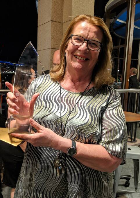 PROUD MOMENT: Mount View High School principal Desley Pfeffer with the school's trophy for Best Student Wellbeing Program.