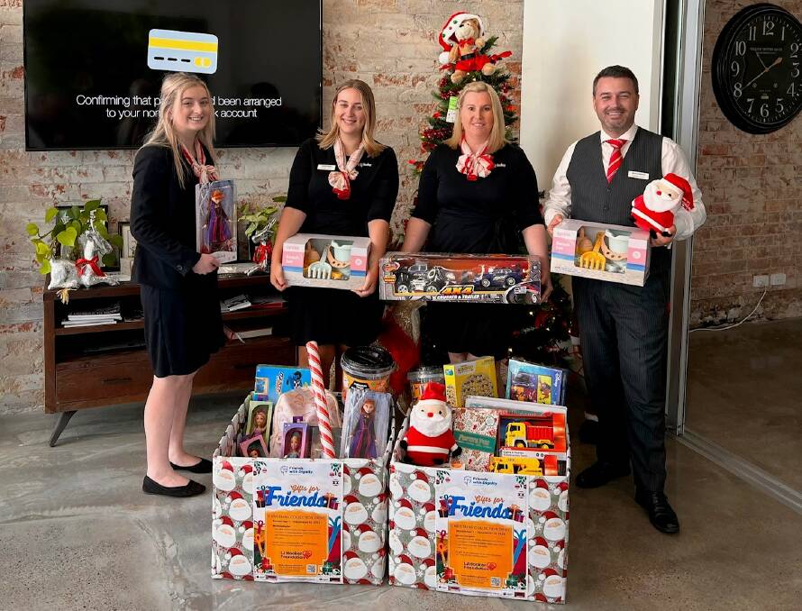 LJ Hooker Cessnock staff Bree Perkins, Sophie Finlay, Mellissa Gibson and Bryce Gibson with some of the items that have been donated to Friends with Dignity. Picture supplied.