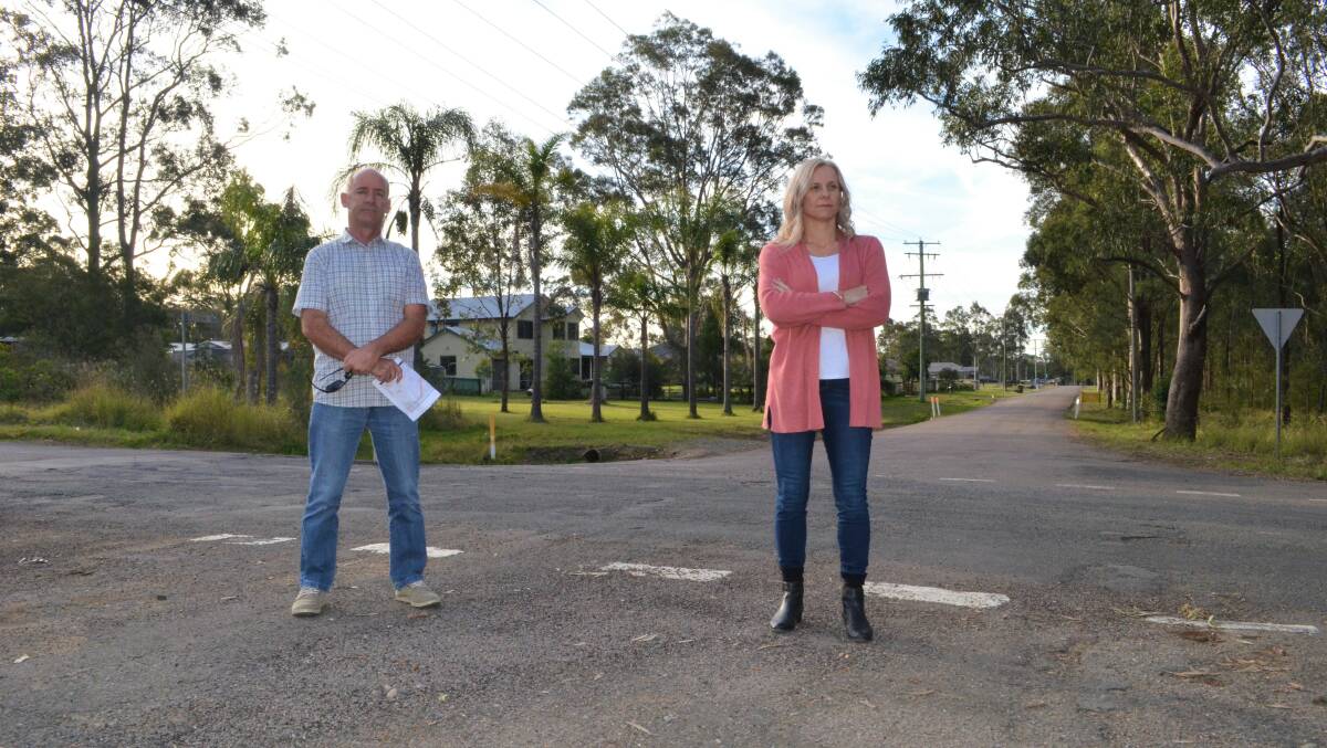 SAFETY CONCERNS: Nulkaba residents Malcolm Hall and Karen Shearer at the site of the proposed new entry road to Cessnock Correctional Centre.