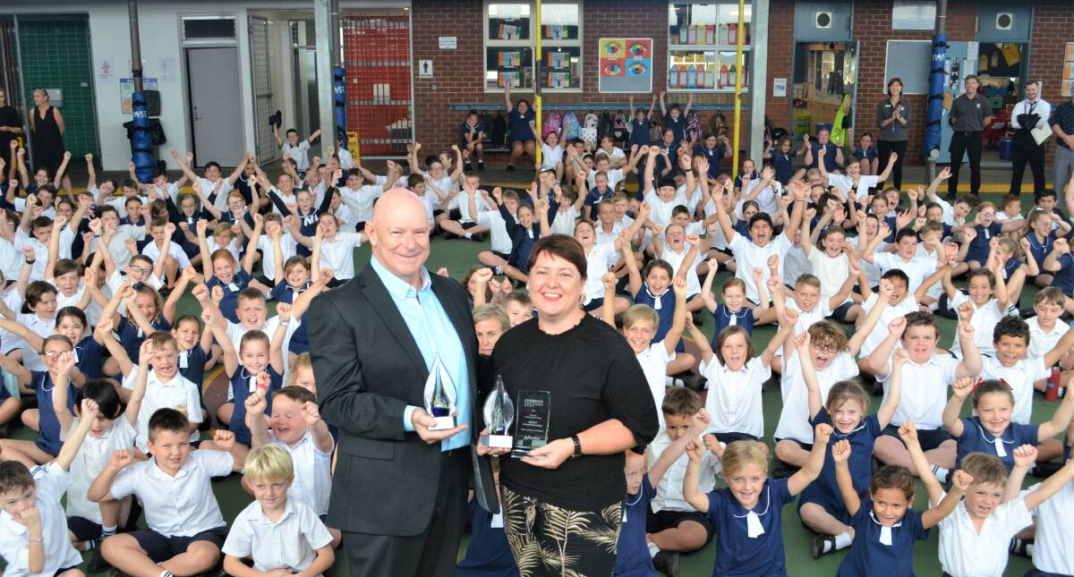 RECOGNITION: Cessnock Chamber of Commerce president Allan Davies presents Kylie Hoad with her awards at St Patrick's Primary School on Monday morning. Picture: Krystal Sellars