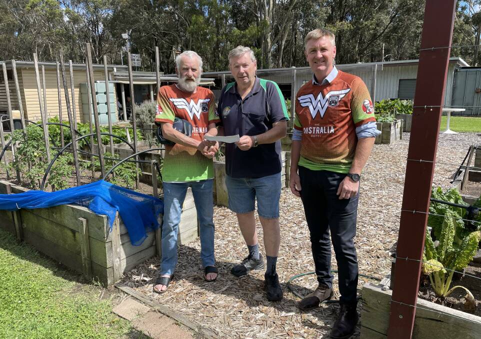 SUPPORT: Australia Hotel veterans' touch football members Daryl Thornberry (left) and Heath Baird (right) with Cessnock Men's Shed and Garden secretary Col Chapman.