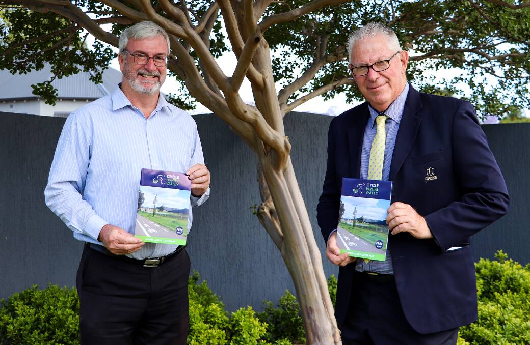 GREAT RESOURCE: Cessnock City Council economic development officer Brad Sangster and Mayor Bob Pynsent with the Cycle Hunter Valley brochure. 