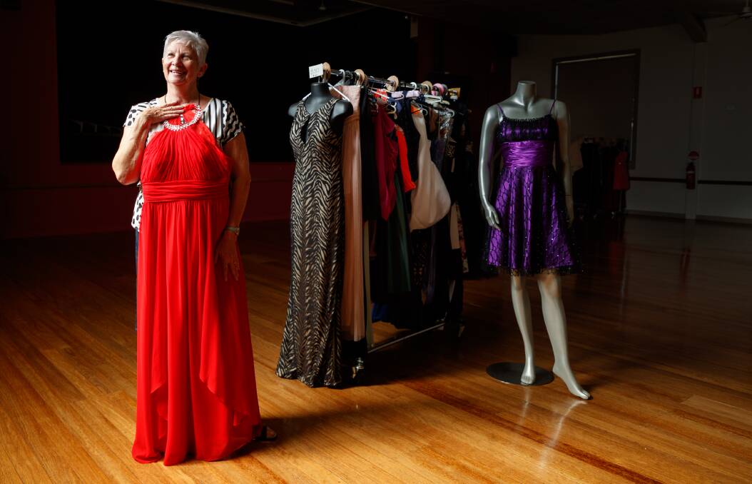 BEAUTIFUL BARGAINS: Pop-up formal wear shop organiser Helen Scott, with some of the dresses that will be available for sale at Branxton Community Hall this Saturday. Picture: Max Mason-Hubers