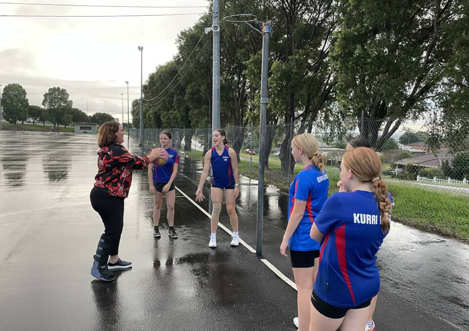 TAKING A SHOT: Moon boot and all, Meryl Swanson is tests out her goal shooting skills with Kurri Kurri representative netballers.