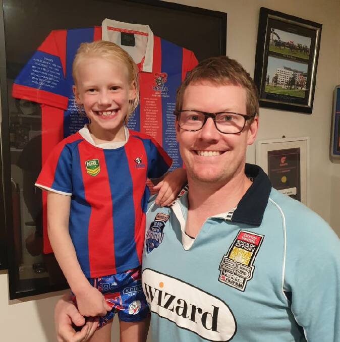 WINNER: Pictured with his daughter Darcy, Matthew Evans of Matthew Evans Podiatry and Sports Services won the Advertiser's business footy tipping competition.