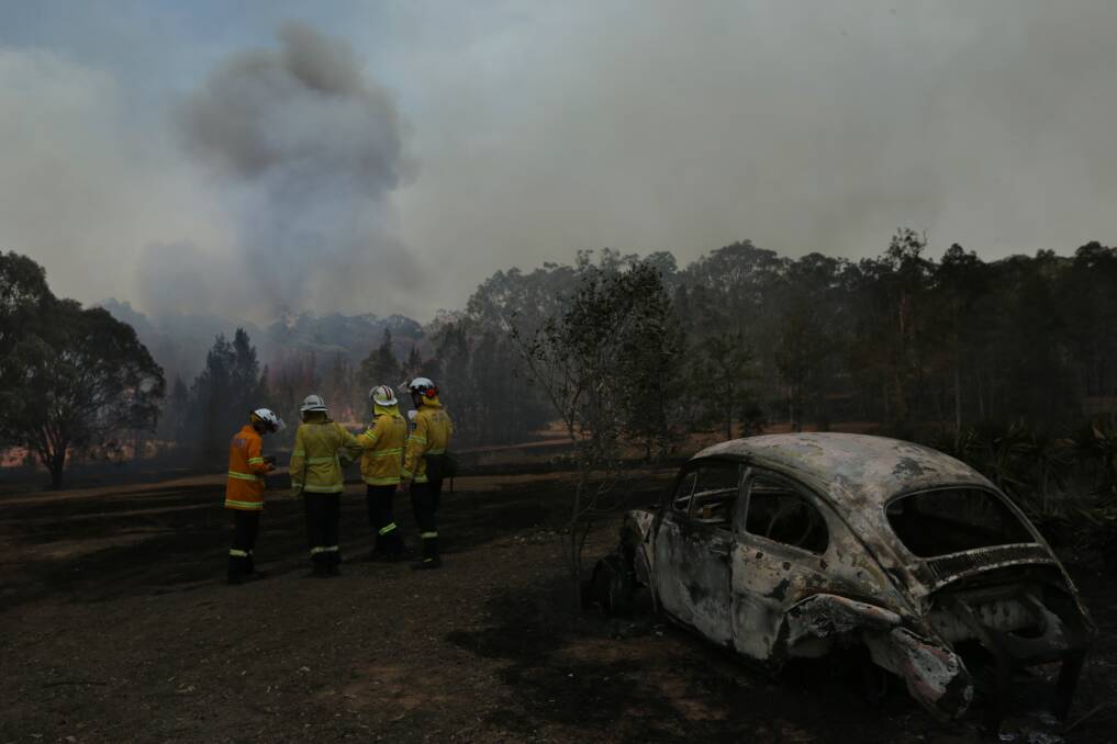 DANGER: Firefighters monitoring a blaze near Greta in November last year. Picture: Simone de Peak