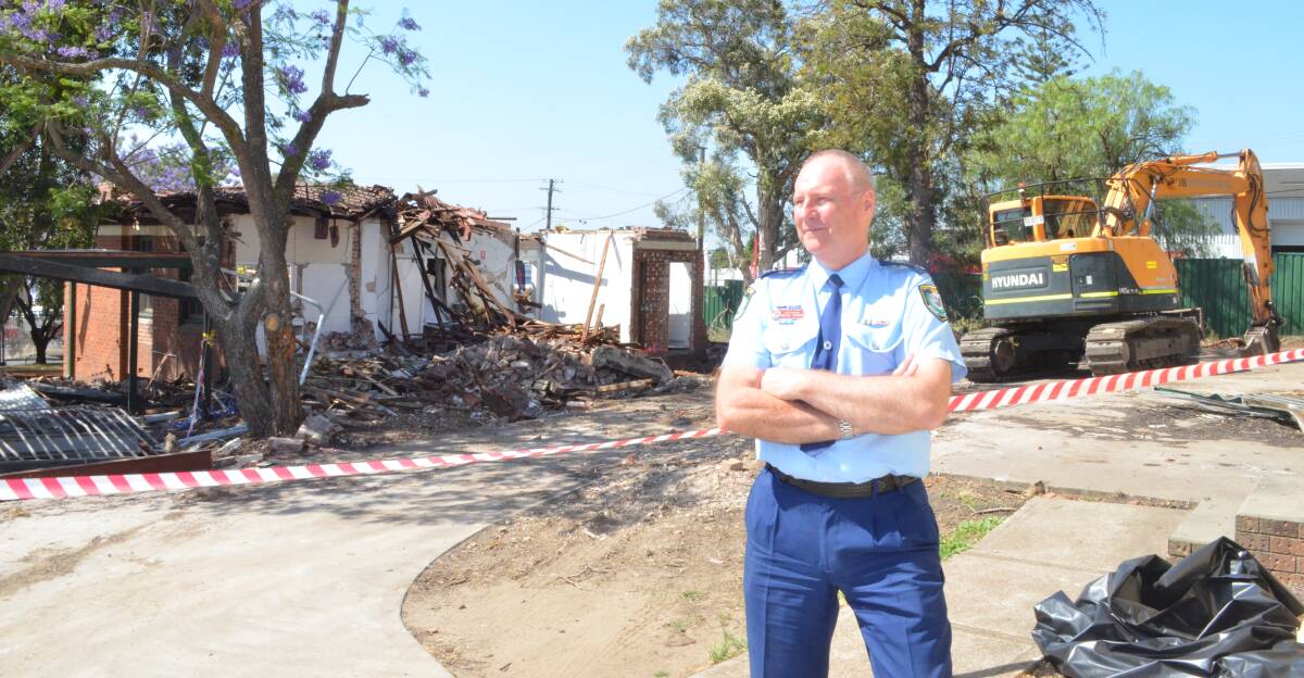 WORK UNDERWAY: Cessnock Police Station officer-in-charge, Chief Inspector Michael Gorman on site where demolition work started last week, making way for a new station.