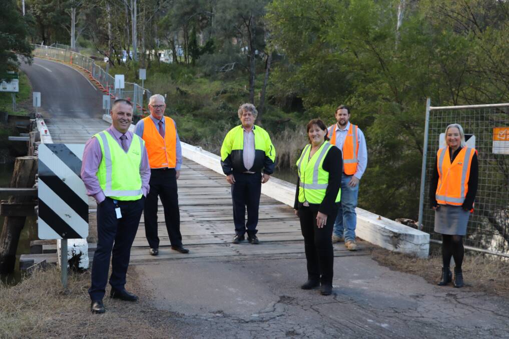 JOINT PROJECT: Singleton Council general manager Jason Linnane, Cessnock mayor Bob Pynsent, project engineer Jim Gilford, Singleton mayor Sue Moore, project manager Chris Purcell and Cessnock City Council general manager Lotta Jackson at Paynes Crossing Bridge, where a new bridge will be built. 