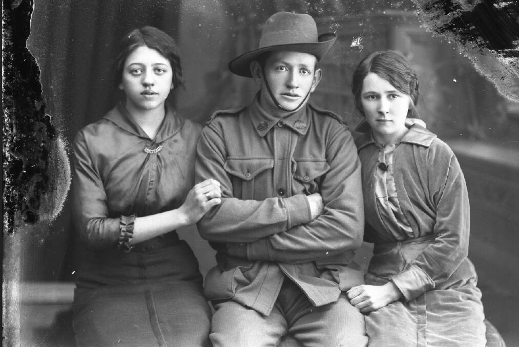 UNCOVERED: John Germyn, who later was awarded the Military Medal, was photographed by Alexander Galloway with his wife and sister-in-law.
