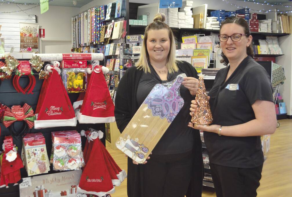 EXCITING TIME: Cessnock Plaza News & Gifts staff Katie Ross and Sarah Pascoe with some of the Christmas gift ideas that are available in store.